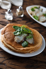 Homemade crepes with smoked fish