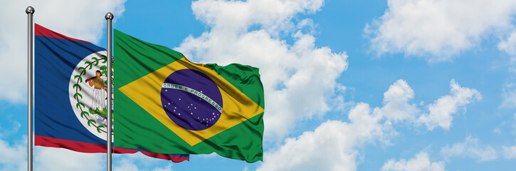 Belize and Brazil flag waving in the wind against white cloudy blue sky together. Diplomacy concept, international relations.