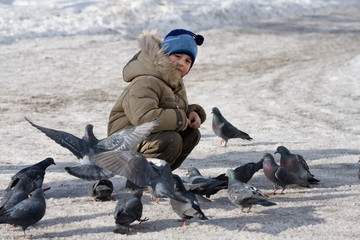Boy and pigeons