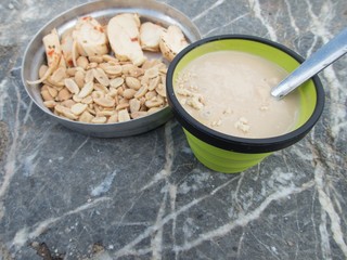 outdoor cooking camping breakfest with porridge