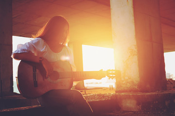 Candid silhouette woman chill play acoustic guitar musician .Artists female sad mood activity music - 298254744
