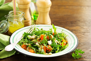 salad with pumpkin, feta and arugula. . Selective focus