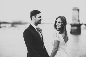 Sensual portrait of a young wedding couple. Outdoor