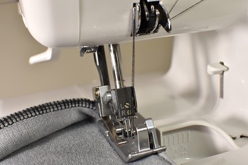 Sewing machine, overlocker, serger close up view, overlock seam.