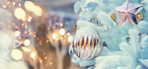 Merry Christmas and happy New Year concept. elegant glamorous new year decor and beautiful Christmas tree. Winter holiday season background. copy space. template for design