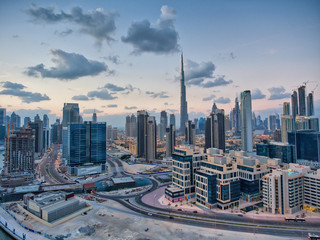 Obraz premium Downtown Dubai at sunset, UAE. Amazing aerial view from drone