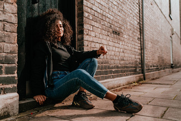 Portrait Charming Young African Woman with Curly Hair, Street Style