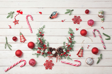 Christmas wreath on white wooden backdrop