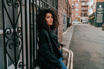 Portrait Charming Young African Woman with Curly Hair, Street Style