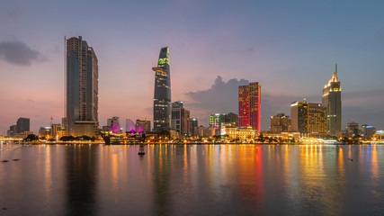 Sunset of night Ho Chi Minh Skyline of Financial District. Saigon , Vietnam.city illuminated with...
