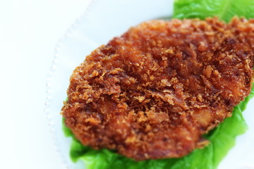 Japanese food, pork cutlet on lettuce with copy space