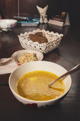 Traditional national Ukrainian and Russian soup pickle with kidneys in a plate on the table in the restaurant. Close up