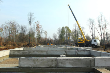 Fototapeta na wymiar Construction of rebars, foundation pad and formwork of a building