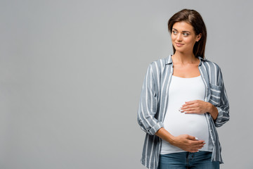 beautiful pregnant woman touching tummy isolated on grey - Powered by Adobe