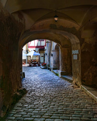 Fototapeta na wymiar Ancient narrow street in old medieval town 