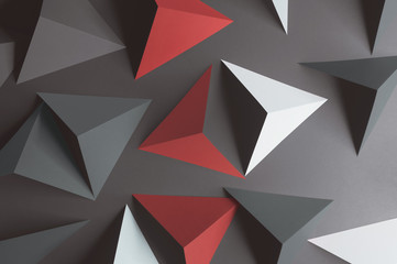 Composition with triangular shapes, red background