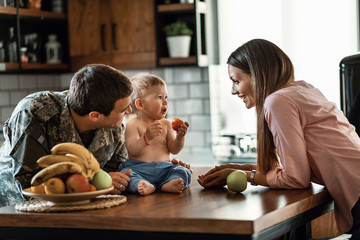 Happy military family enjoying together at home.