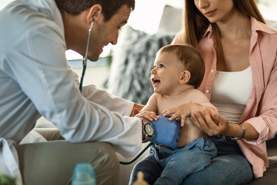 Cute Baby Boy Having Fun During Medical Appointment At Pediatrician's.