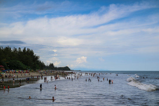 PARIAMAN, INDONESIA - JULY, 6 2019; The atmosphere on one of the beaches in West Sumatra