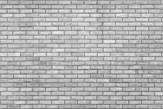 monochrome grey brick wall with repeating pattern