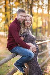 Fototapeta premium A portrait of young married couple expecting a baby