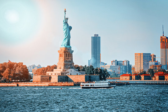 Statue of Liberty on Liberty Island on the background New York Harbor and New York City.