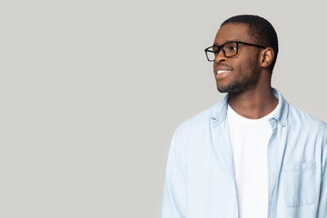 Smiling African American man in glasses looking at copy space