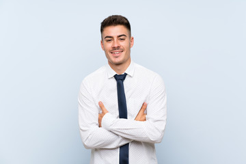 Handsome businessman over isolated blue background laughing