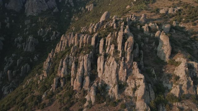 Aerial view big stone pillars in Crimean peninsula. Valley of ghosts during sunset