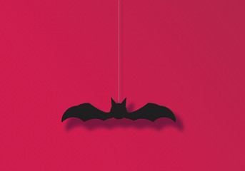 Illustration of a bat ornament hanging on the wall.  壁に吊り下げられたコウモリの飾りのイラスト