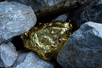 Gold nugget and grey granite stone