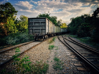 Railways with iron wagons. Industrial landscape with transport