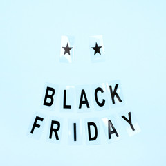 Flat lay with the inscription black friday on a blue background.