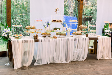 catering services in restaurant. Wedding table reception on wedding ceremony in restaurant outdoors in the forest