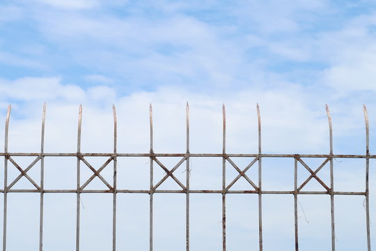 Steel fence on the sky background, security or forbidden boundary area zone