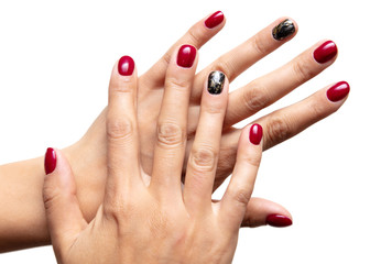 Hands of a girl with red manicure