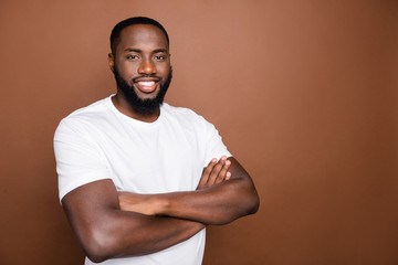 Photo of cheerful toothy positive attractive handsome black man standing confidently with hands...