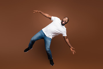 Full length body size view of his he attractive funny cheerful cheery crazy guy having fun fooling...