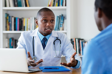 African american doctor has bad news for male patient