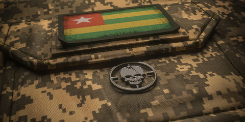 Togolese Republic army chevron on ammunition with national flag. 3D illustration