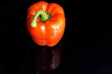 red pepper on black background