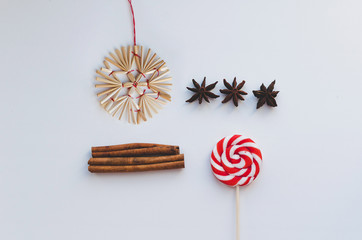 candy, cinnamon, anise and christmas decor isolated on white background