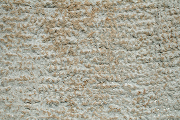 Old weathered mossy sandstone surface with lichens closeup as stone background