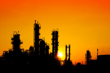 Fototapeta na wymiar Oil and gas refinery industry in silhouette image on orange sky sunset background, Petrochemical plant, Factory of petroleum at evening