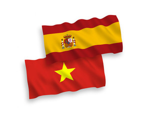 Flags of Vietnam and Spain on a white background
