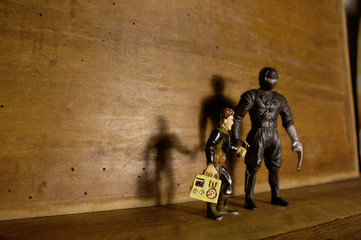 black knight superhero on wooden blackboard with shadow and copyspace