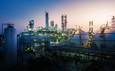 Manufacturing of petroleum industrial plant with gas storage tanks, Petrochemical plant on sunset sky background