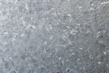 Frosty pattern on the glass. Thin ice crystals on the window gla