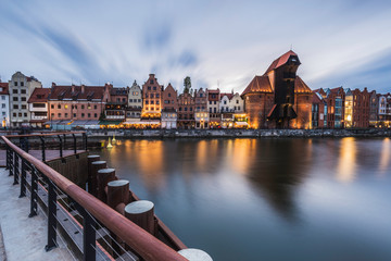 Fototapeta na wymiar Old town and medieval crane in Gdansk evening cityscape.
