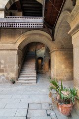 Exterior daylight shot of staircase going up leading to Wikalet Bazaraa historic public Caravansary building, suited in Gamalia district, Medieval Cairo, Egypt